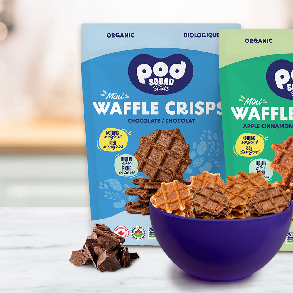 Three bags of Pod Squad Snacks Mini Waffle Crisps with a bowl of waffle crisps on a table.